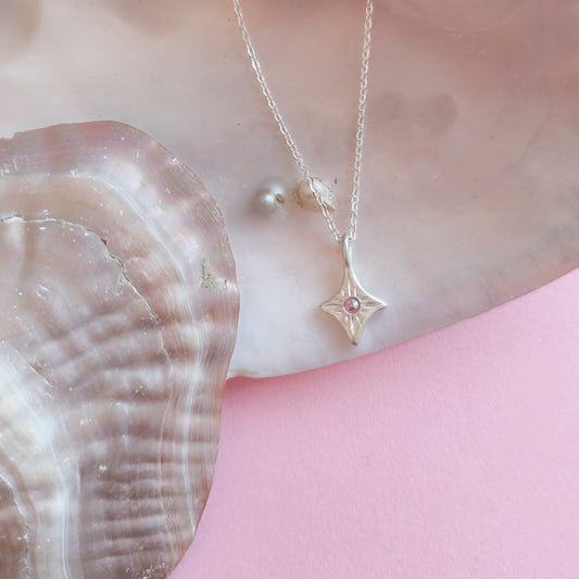 Colgante artesanal destello cristal Swarovski boreal fucsia en plata