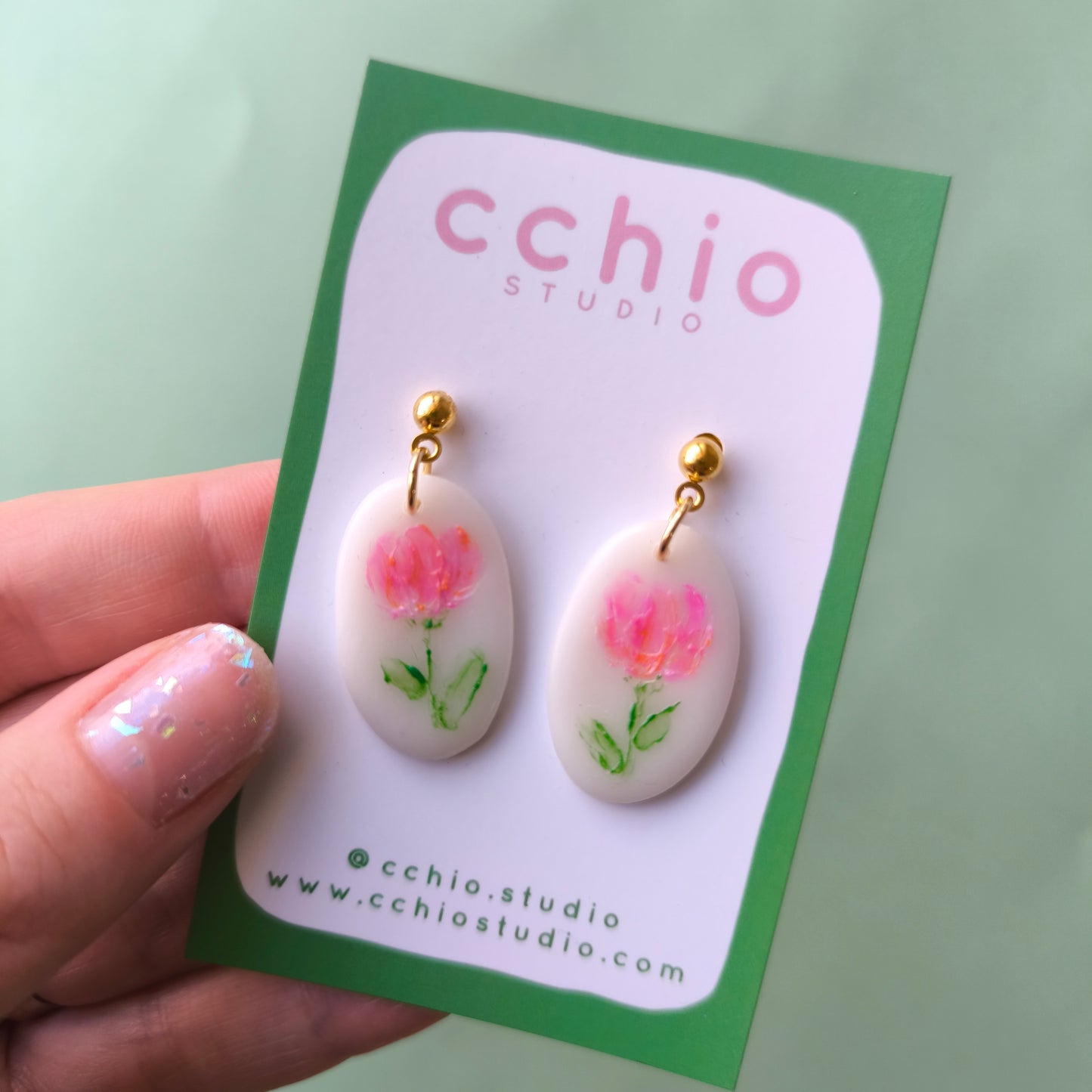 Pendientes pintados a mano ovalado con flor fucsia y naranja